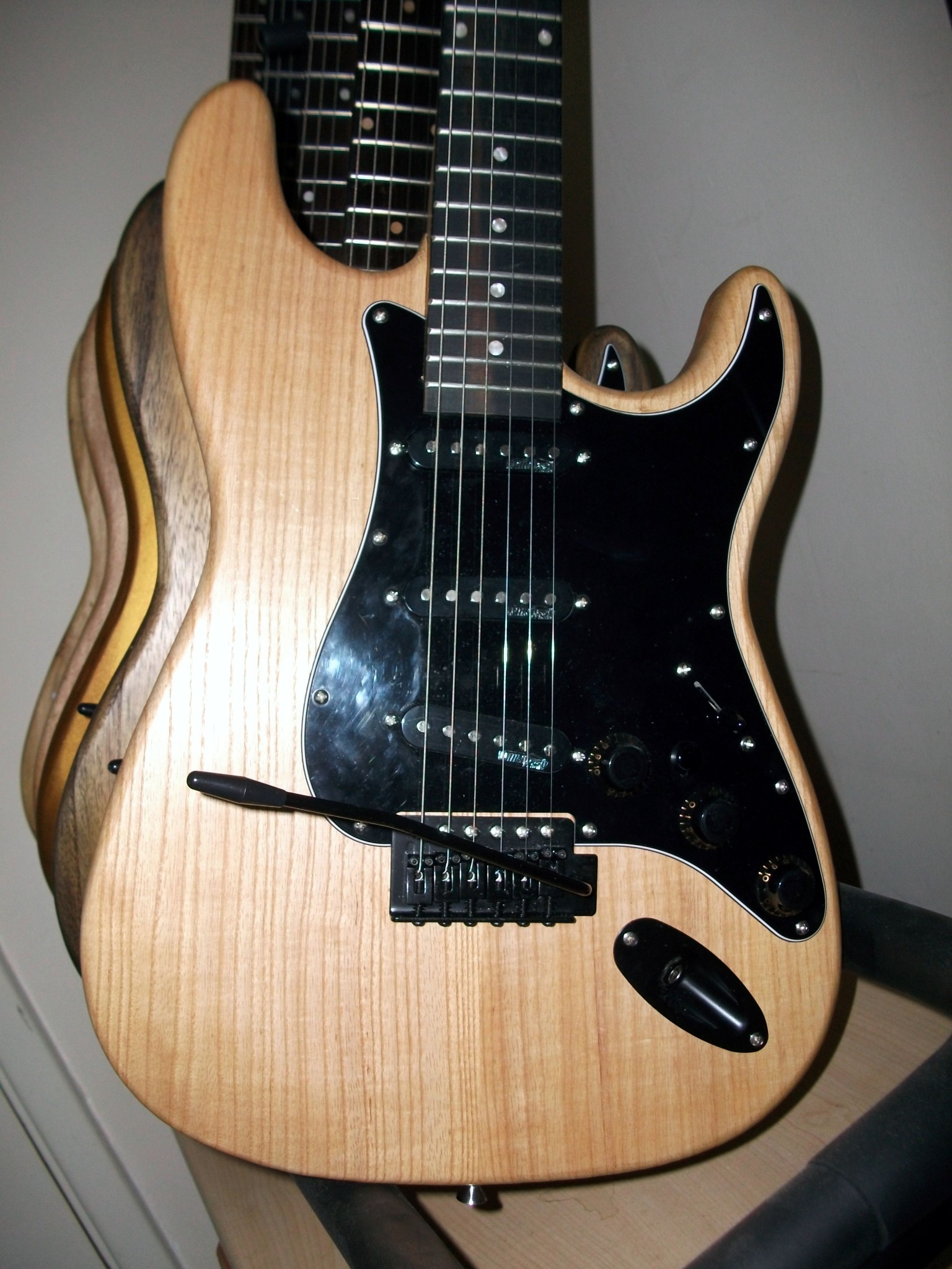 Custom electric guitar with black scratchplate